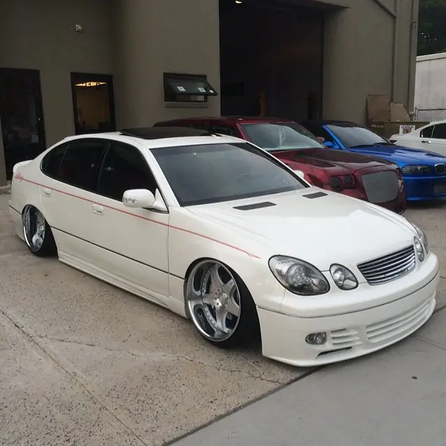 White Lexus GS on polished wheels