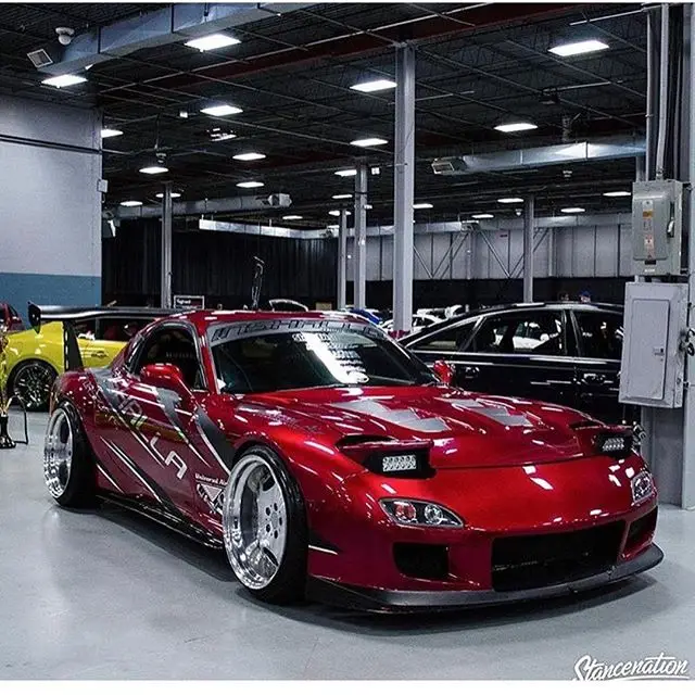 Red Mazda RX-7 indoors